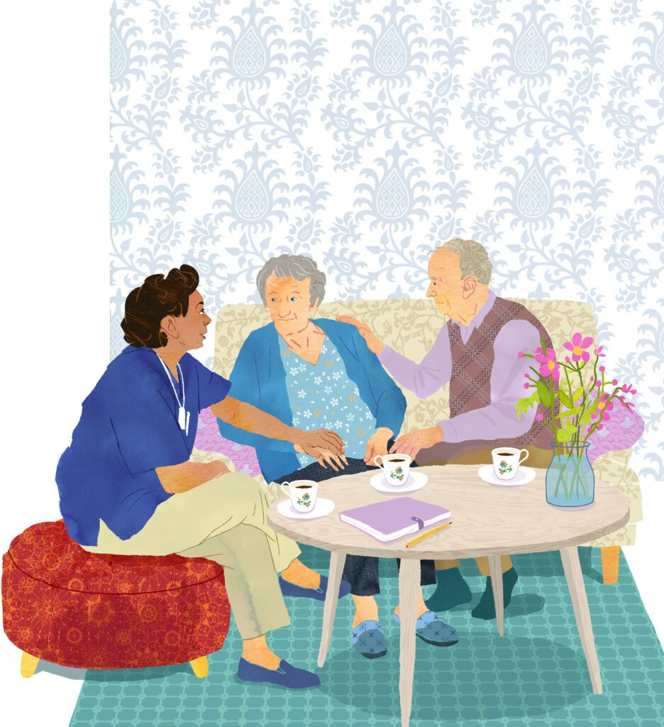 Caregiver supporting elderly couple at home in palliative care setting