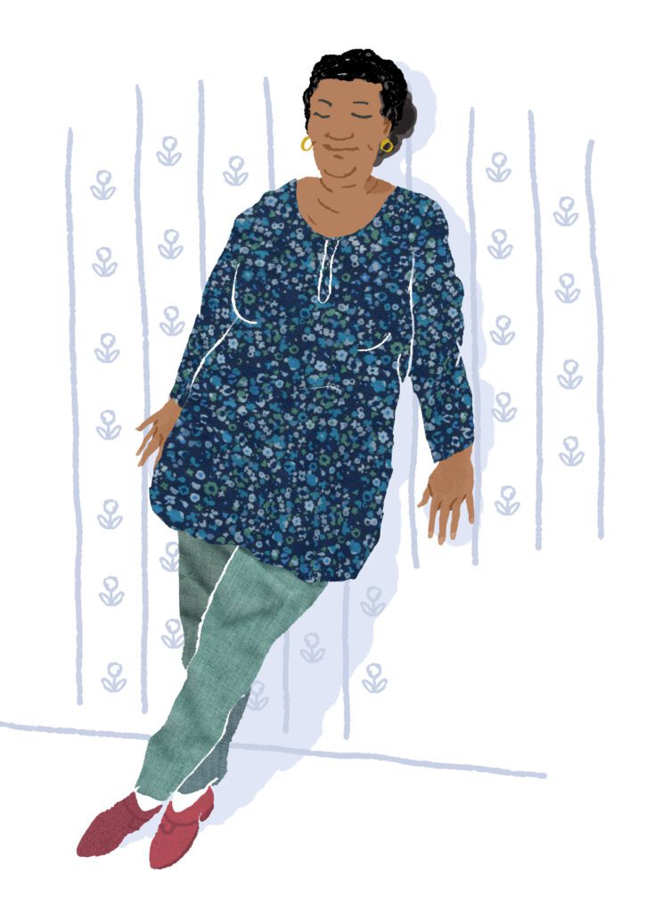 Woman crossing her legs and leaning against a wall to prevent fainting