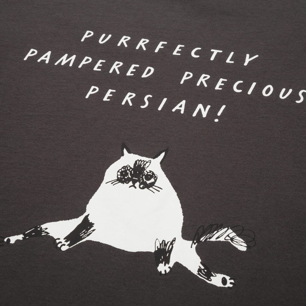 Close-up of hand-drawn Persian cat graphic on charcoal grey Uniqlo UT T-shirt