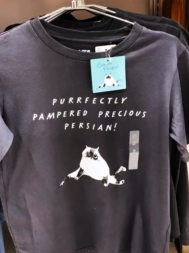 Uniqlo store display featuring Marie Åhfeldt cat illustration T-shirt