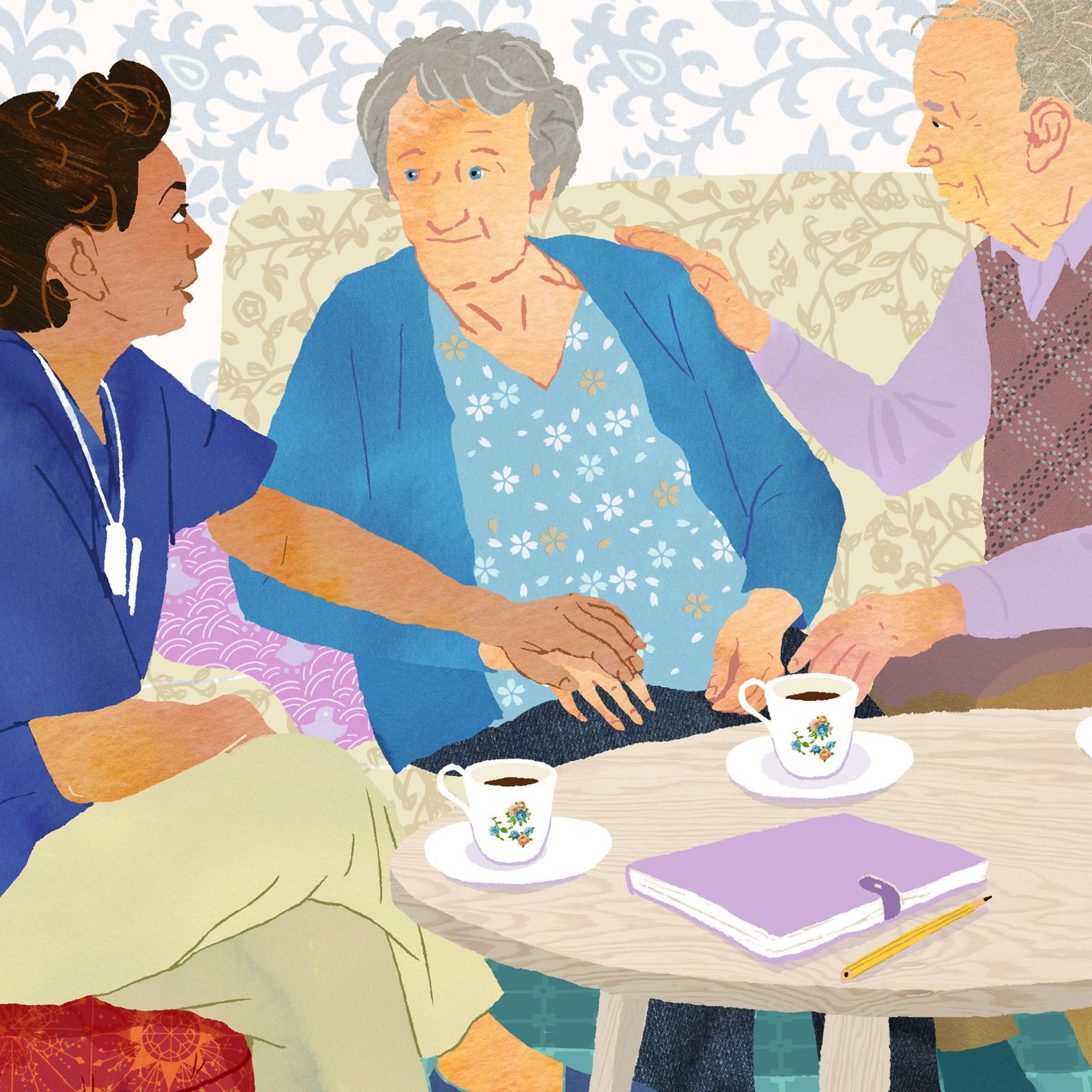 Care worker talking with an elderly woman and a man at a table